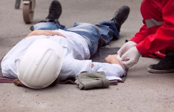 construction worker wrapped by a doctor